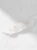 Recznik-Bialy-z-srebrna-biza-LIBRE (6).webp